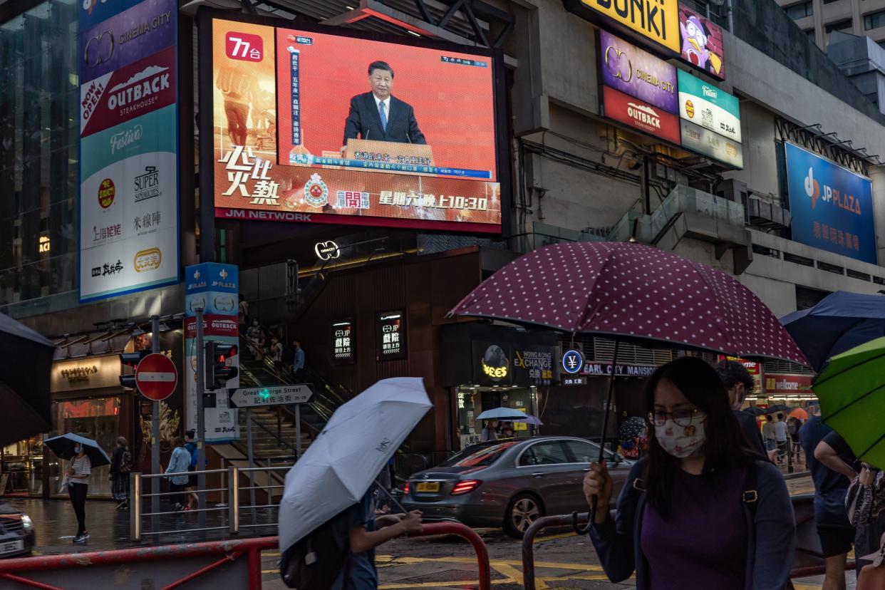 Chinese President Xi Jinping speaks during a news conference, displayed on a television screen at a shopping area on June 30, 2022 in Hong Kong, China. Hong Kong will celebrate the 25th anniversary of its handover from Britain to China on July 1.