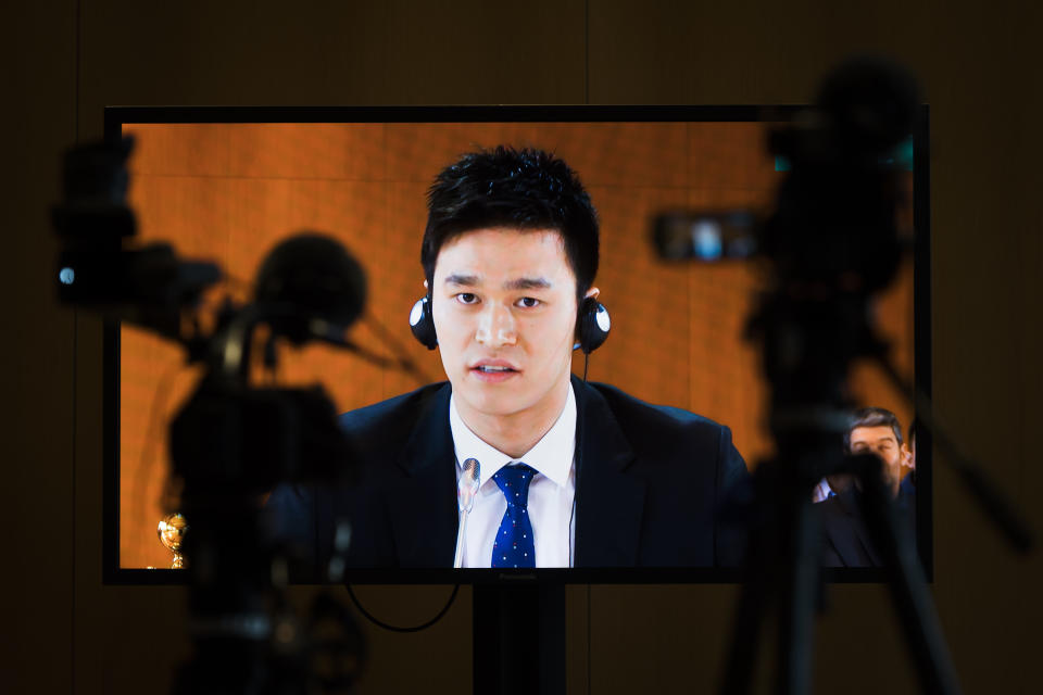 Swimmer Sun Yang is seen on a video screen as he speaks during a public hearing at the Court of Arbitration for Sport (CAS) in Switzerland.