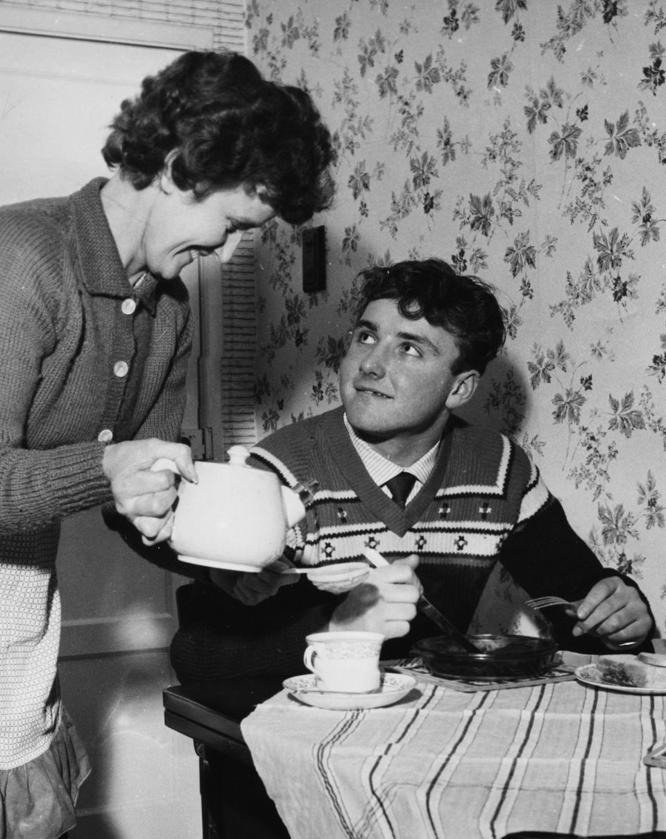 With his mother on the morning of his first-team debut in 1962 aged 15 years and 314 days  - Keystone/Hulton Archive/Getty Images