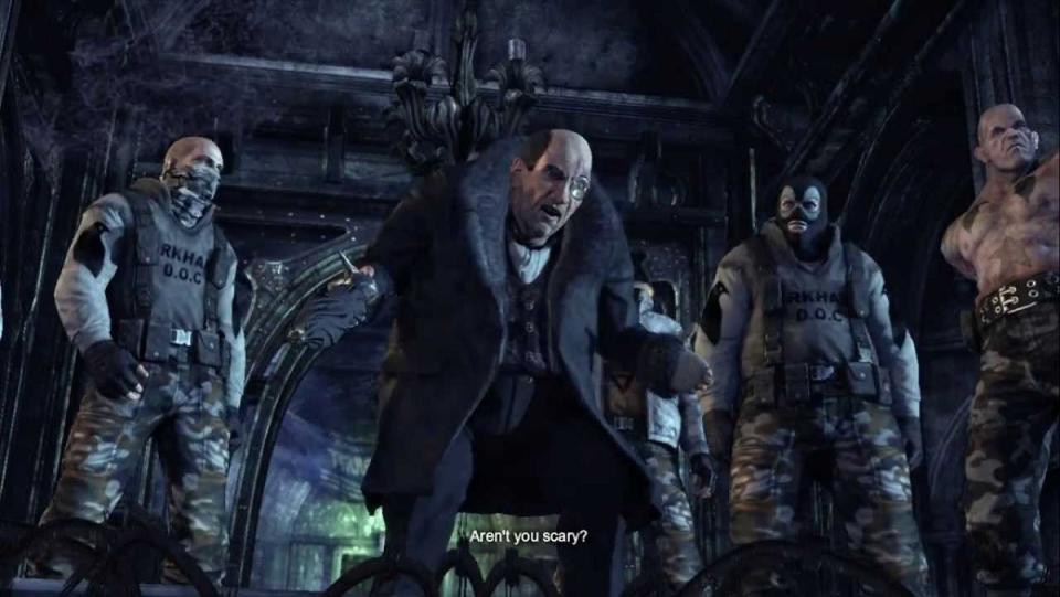 The Penguin asks "Aren't you scary?" surrounded by various goons in Batman: Arkham City.
