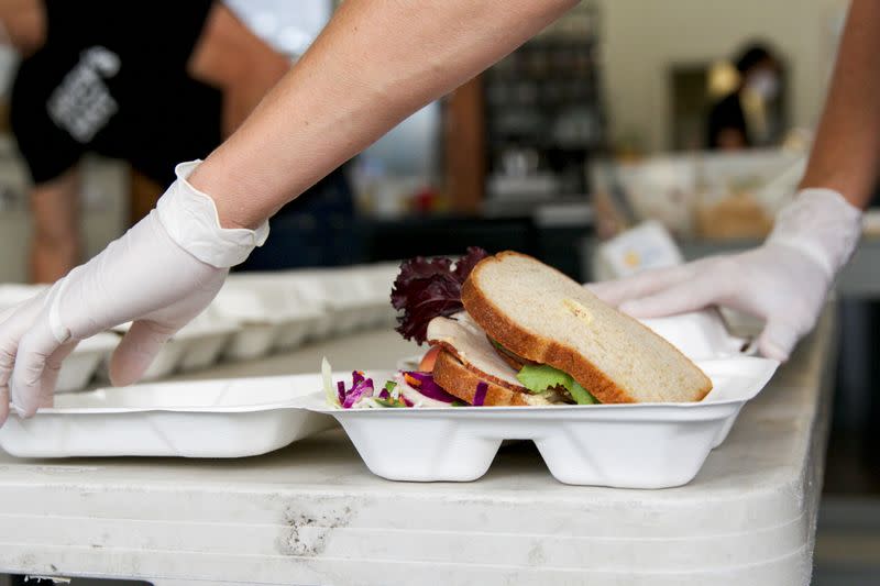 Amy Hillyard, co-owner of Farley’s East, closes a lunch order for World Central Kitchen in Oakland, California