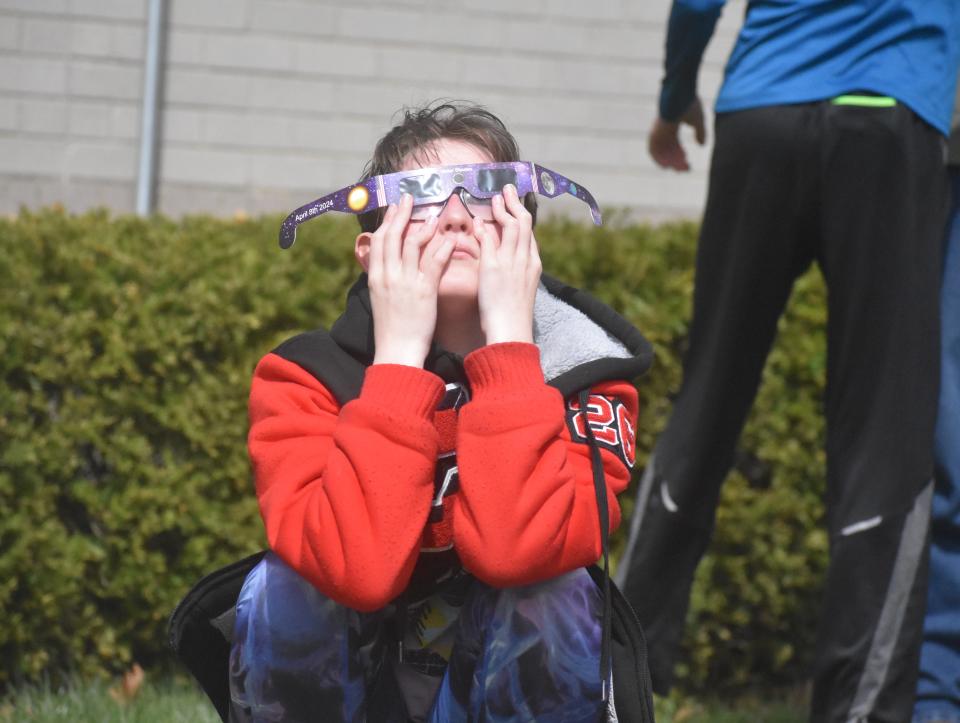 Delilah Buckmaster of Tipton and a sophomore at Clinton Community Schools, was among those patrons who attended the Clinton Township Public Library's solar eclipse viewing party on Monday, April 8, 2024. Solar eclipse viewing glasses were provided by the library to those in attendance at the event at no cost.