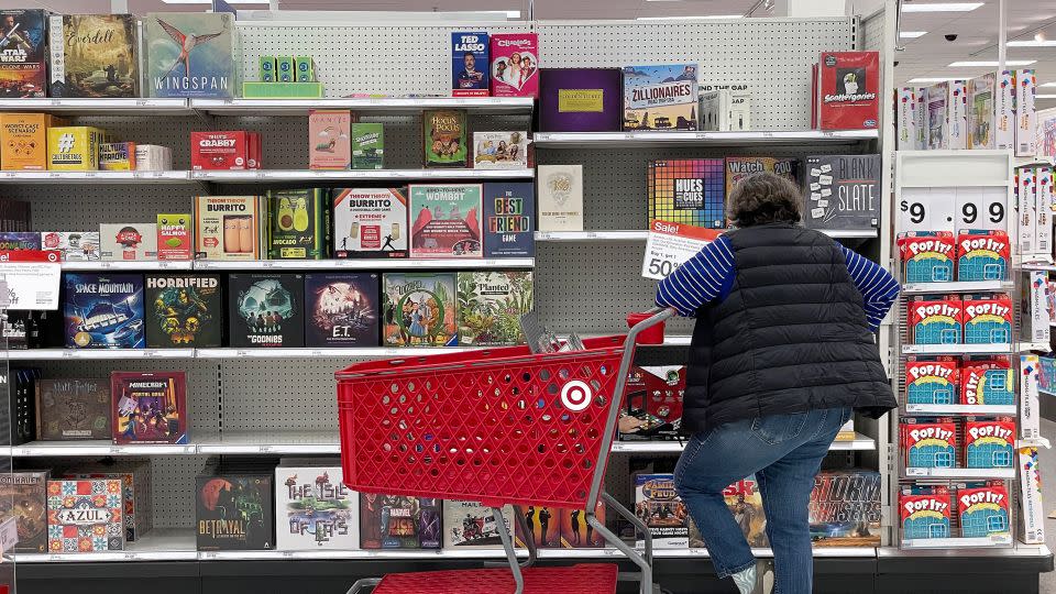 A customer looks at a display of board games while shopping at a Target store on December 15, 2022, in San Francisco, California. - Justin Sullivan/Getty Images