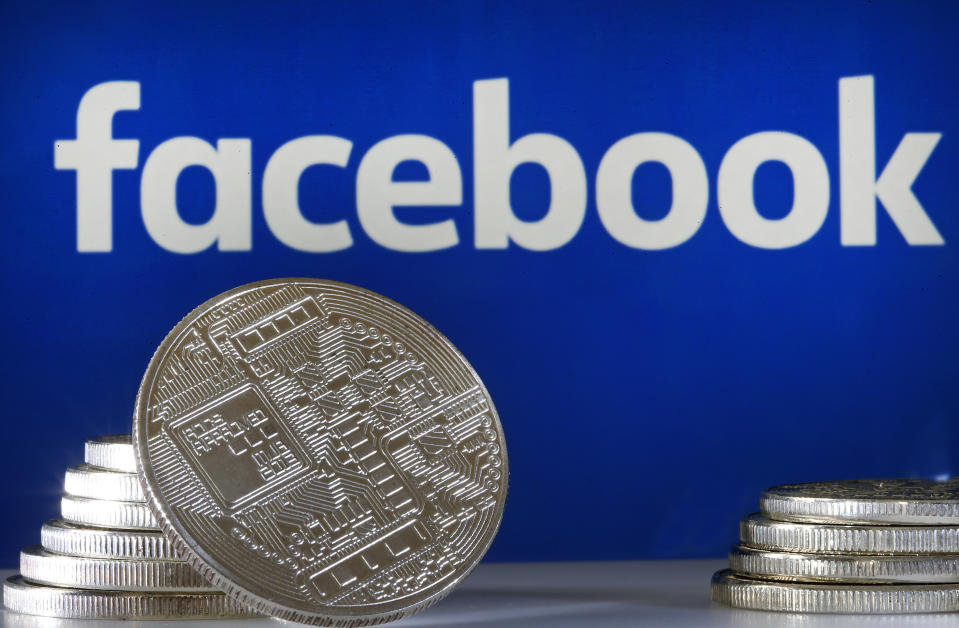 PARIS, FRANCE - JUNE 18: In this photo illustration, a visual representation of a digital cryptocurrency coin sits on display in front of a Facebook logo on June 17, 2019 in Paris, France. Facebook will announce Tuesday, June 18 the details of its cryptocurrency, called " Libra ". Like bitcoin, the best-known virtual currency, it will rely on blockchain technology. This universal currency must allow its users to buy products or services from the Facebook universe, which also owns Messenger, Instagram and WhatsApp. It will also be possible to transfer "Libras" between individuals. Several companies like Visa, MasterCard, PayPal and Uber have already joined the consortium created by Facebook. (Photo by Chesnot/Getty Images)