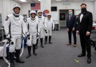 FILE PHOTO: SpaceX CEO and founder Elon Musk visits with astronauts before their launch to the International Space Station