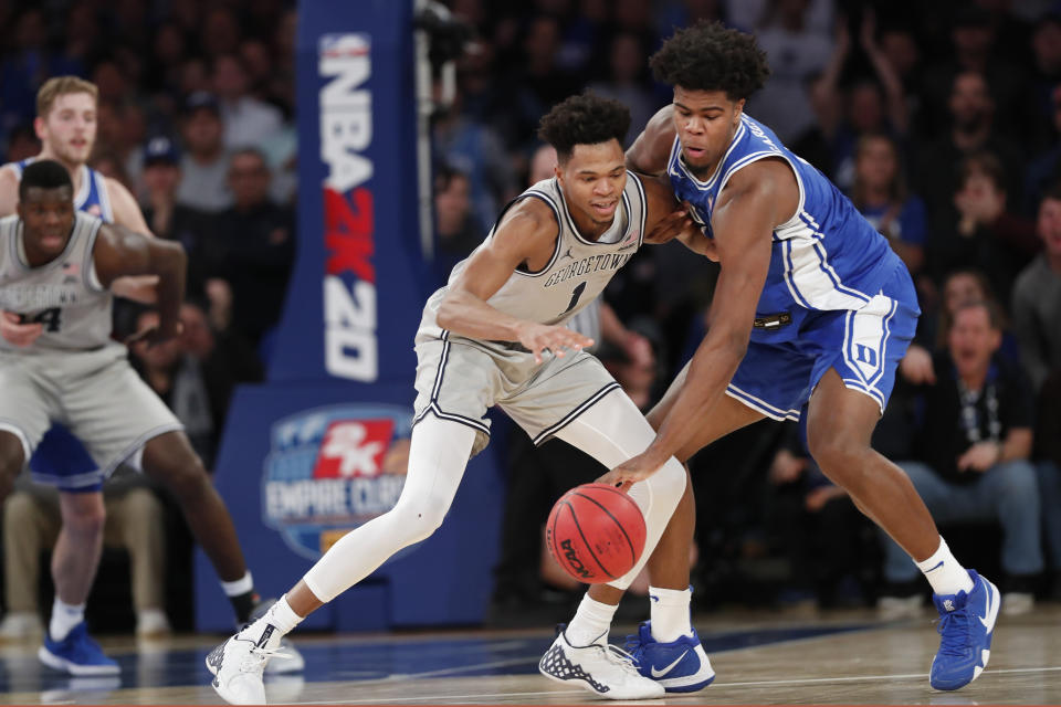 Duke center Vernon Carey Jr., right, steals the ball from Georgetown forward Jamorko Pickett during the first half of an NCAA college basketball game in the 2K Empire Classic, Friday, Nov. 22, 2019 in New York. (AP Photo/Kathy Willens)