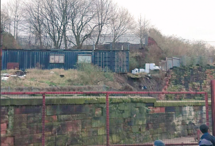 It is thought concrete and cabins on top of the wall caused the collapse (Network Rail)