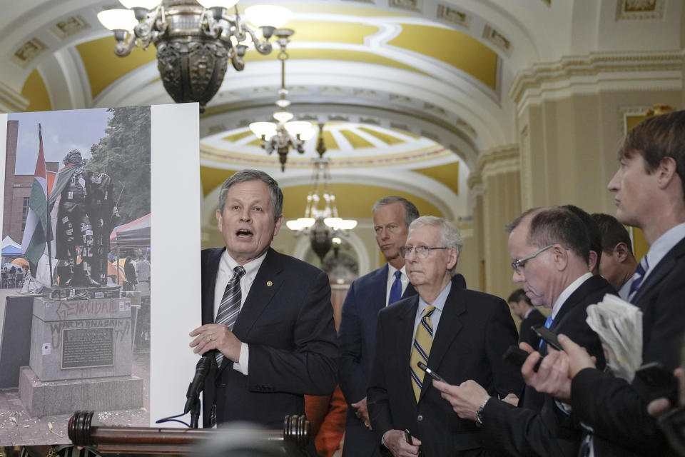 Sen. Steve Daines, R-Mont., left, talks after a policy luncheon on Capitol Hill Wednesday, May 8, 2024, in Washington. (AP Photo/Mariam Zuhaib)