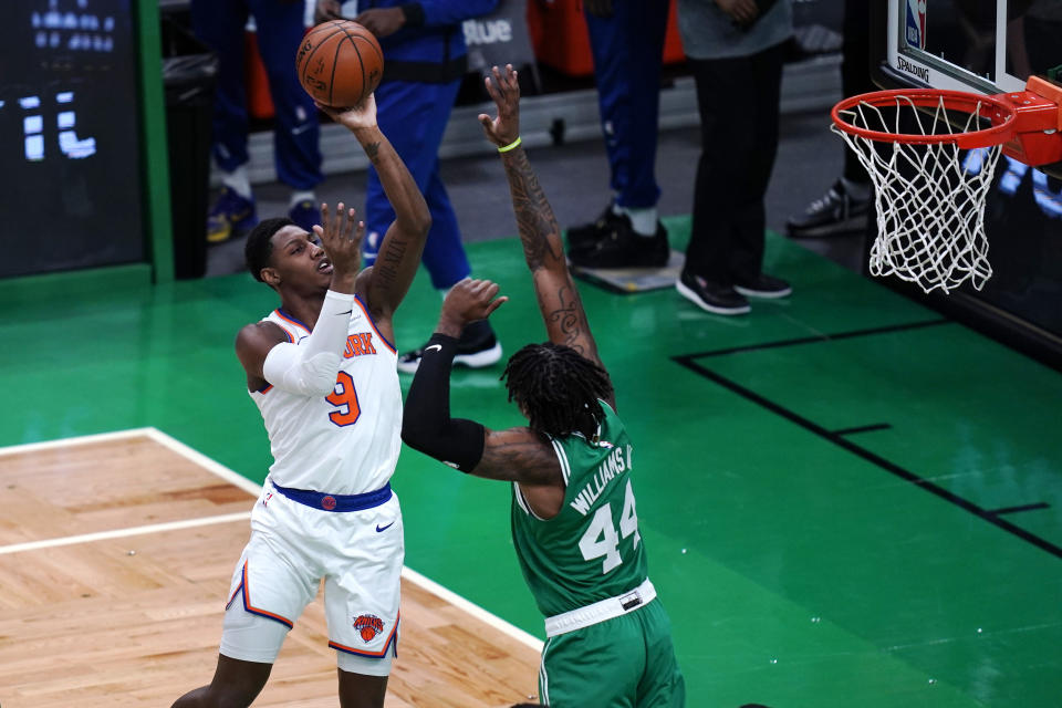 New York Knicks guard RJ Barrett (9) shoots over Boston Celtics center Robert Williams III (44) during the first half of an NBA basketball game Wednesday, April 7, 2021, in Boston. (AP Photo/Charles Krupa)