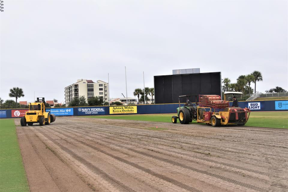 Crews from Craft Turf Farms in Gulf Shores remove the field sod at Blue Wahoos Stadium in preparation for a new synthetic playing surface.
