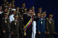 <p>Venezuelan President Nicolas Maduro (C) delivers a speech during a ceremony to celebrate the 81st anniversary of the National Guard in Caracas on Aug. 4, 2018 day in which Venezuela’s controversial Constituent Assembly marks its first anniversary. (Photo: Juan Barreto/AFP/Getty Images) </p>