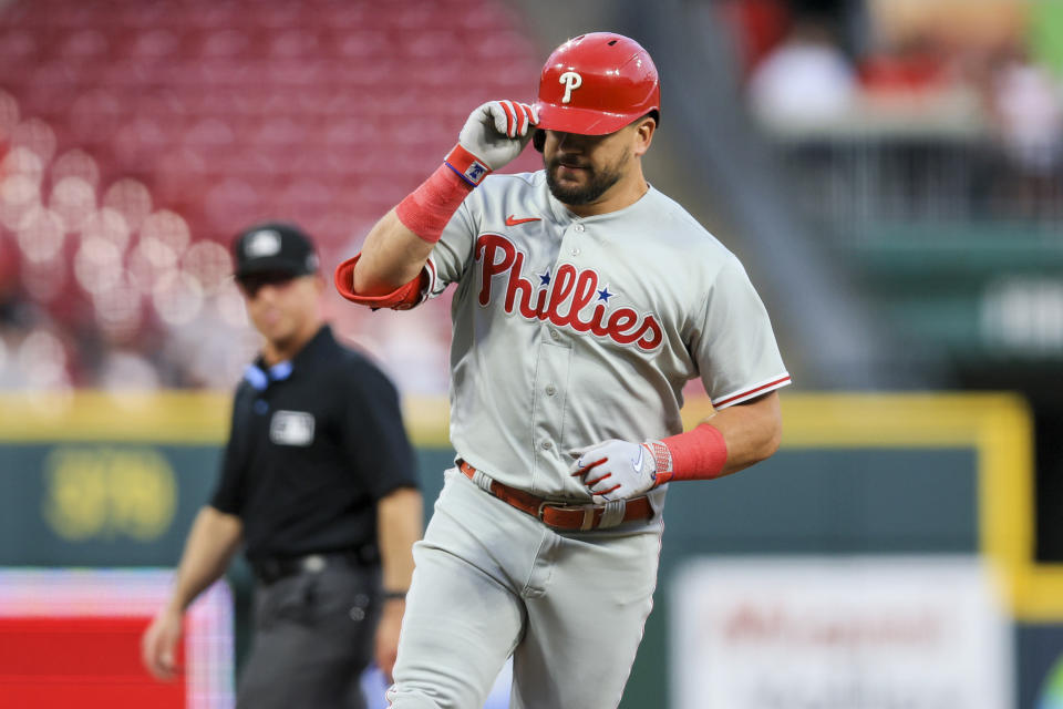 Philadelphia Phillies' Kyle Schwarber tips his helmet as he runs the bases after hitting a solo home run during the fifth inning of a baseball game against the Cincinnati Reds in Cincinnati, Thursday, April 13, 2023. (AP Photo/Aaron Doster)