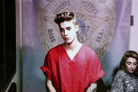 Pop singer Justin Bieber appears via video conference in his first court appearance after being arrested on a drunk driving charge in Miami, Florida in this file photo taken January 23, 2014. REUTERS/Walter Michot/Files