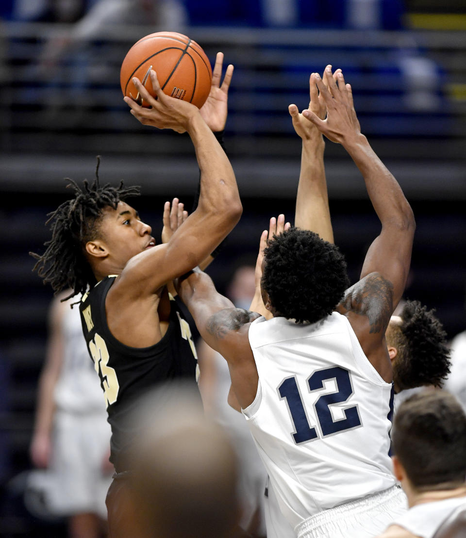 Purdue's Jaden Ivey shoots over Penn State defenders, including Izaiah Brockington (12), during an NCAA college basketball game Friday, Feb. 26, 2021, in State College, Pa. (Abby Drey/Centre Daily Times via AP)