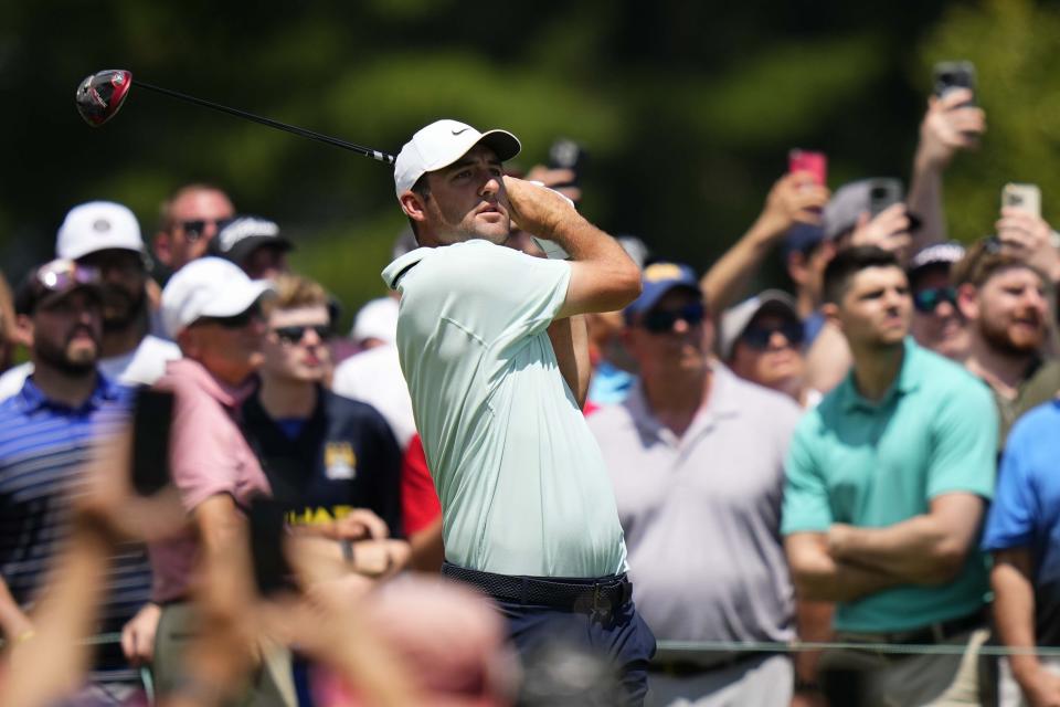 Scottie Scheffler hits from the first tee during the final round of the Travelers Championship golf tournament at TPC River Highlands, Sunday, June 25, 2023, in Cromwell, Conn. (AP Photo/Frank Franklin II)