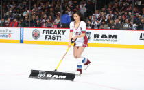 <p>A member of the Colorado Avalanche ice girls clears the ice during a time out against the Los Angeles Kings at the Pepsi Center on January 4, 2016 in Denver, Colorado. (Photo by Michael Martin/NHLI via Getty Images) </p>