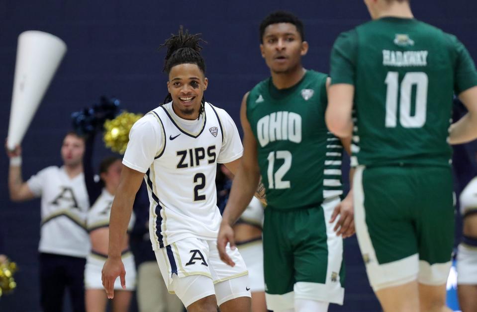 Akron guard Greg Tribble (2) is all smiles after making a first-half 3 against Ohio on Tuesday in Akron.