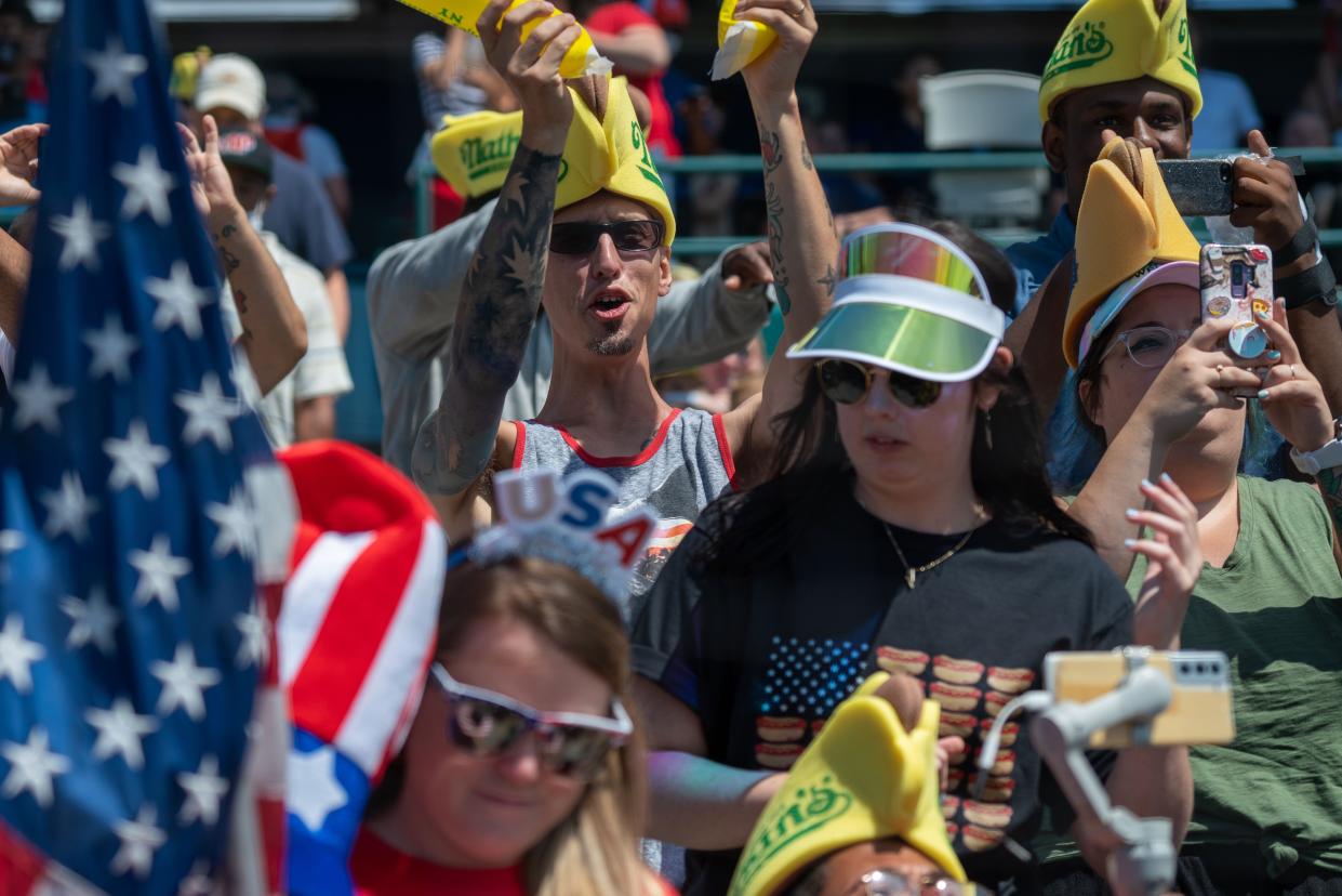 Spectators cheer at Maimonides Park for the 2021 Nathan's Famous 4th Of July International Hot Dog Eating Contest at Coney Island on July 4, 2021, in New York City.