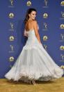 <p>Penelope Cruz swept down the golden carpet at the 2018 Emmy Awards in this theatrical feathered, full-skirted Chanel gown. The custom-made couture dress, which was created from silk tulle, iridescent beads, organza flowers and strands of feathers, took nearly 300 hours to embroider. The actress had been nominated for her role as Donatella Versace in American Crime Story: The Assassination of Gianni Versace.</p>