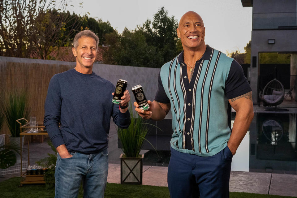 John Shulman, left, and Dwayne Johnson were among a group of partners to create ZOA, a new, better-for-you energy drink that will be distributed by Molson Coors. Credit: Molson Coors
