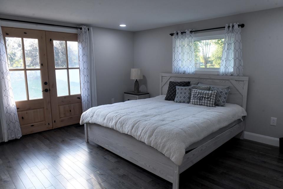 The bedroom is seen in a Lake Township home that has been remodeled in a modern farmhouse style.