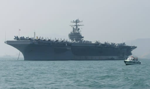 The United States says it is deploying the USS Abraham Lincoln, seen here in December 2004, in response to 'escalatory indications' from Iran