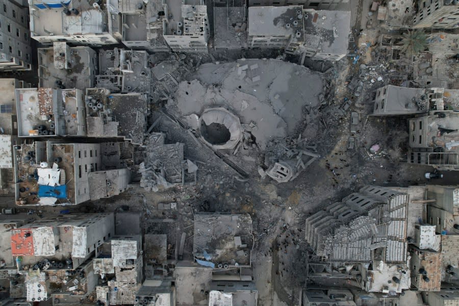 ADDS NAME OF THE MOSQUE -The rubble of the Sousi Mosque, destroyed in an Israeli airstrike, is seen at Shati refugee camp in Gaza City early Monday, Oct. 9, 2023. Israel’s military battled to drive Hamas fighters out of southern towns and seal its borders Monday as it pounded the Gaza Strip. (AP Photo/Hatem Moussa)