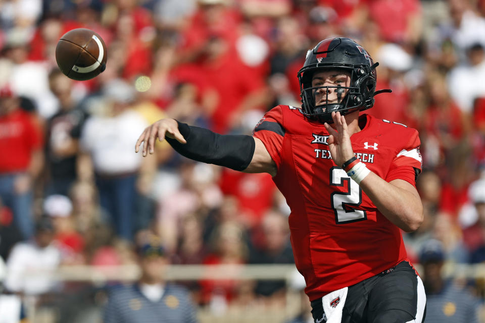 Texas Tech's Behren Morton (2) passes the ball during the first half of an NCAA college football game against West Virginia, Saturday, Oct. 22, 2022, in Lubbock, Texas. (AP Photo/Brad Tollefson)