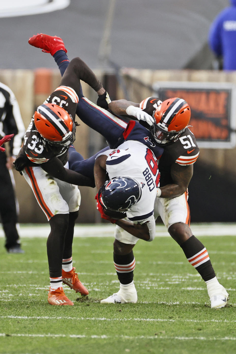Cleveland Browns defensive back Ronnie Harrison (33) and linebacker Mack Wilson (51) tackle Houston Texans wide receiver Randall Cobb (18) during the second half of an NFL football game, Sunday, Nov. 15, 2020, in Cleveland. (AP Photo/Ron Schwane)
