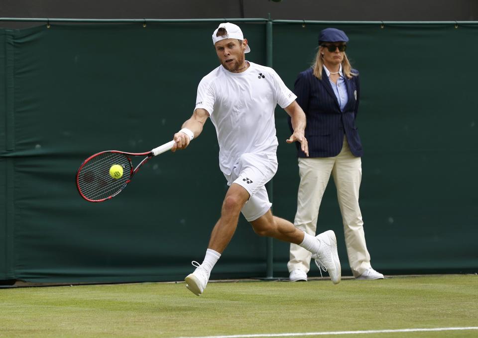 Britain Tennis - Wimbledon - All England Lawn Tennis & Croquet Club, Wimbledon, England - 30/6/16 Moldova's Radu Albot in action against Australia's Bernard Tomic REUTERS/Stefan Wermuth