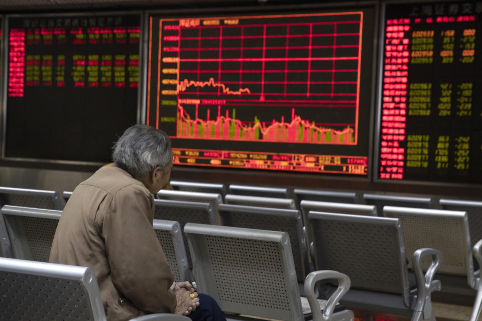 In this Nov. 11, 2019, photo, an investor monitors stock prices at a brokerage in Beijing. Shares were mixed in Asia on Tuesday, Nov. 12, as investors awaited cues on trade talks between China and the U.S. (AP Photo/Ng Han Guan)