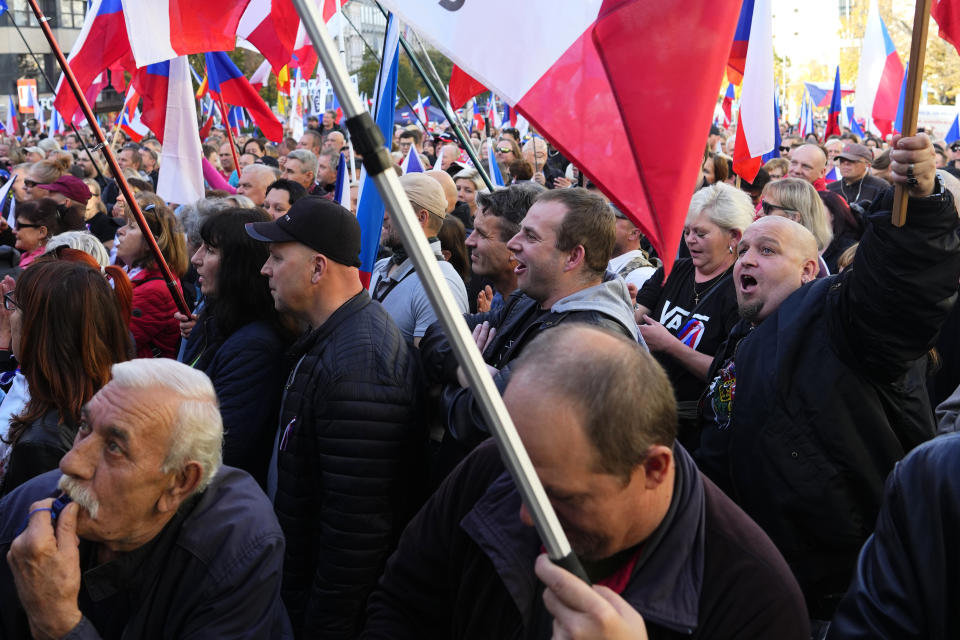 People cheer as several thousands of protesters from the far right and far left gathered to rally against the country's pro-Western Czech government at the Vencesla's Square in Prague, Czech Republic, Friday, Oct. 28, 2022. (AP Photo/Petr David Josek)