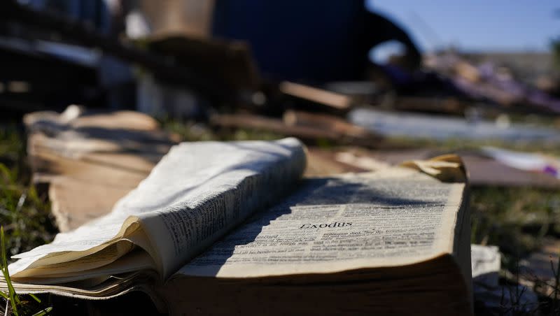A Bible rests on the lawn of Community Baptist Church amongst storm debris Monday, Dec. 11, 2023, in Nashville, Tenn.