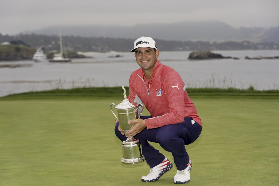 FILE - Gary Woodland poses with the trophy after winning the U.S. Open golf tournament June 16, 2019, in Pebble Beach, Calif. Woodland had brain surgery on Sept. 18, 2023. He returns to competition for the first time at the Sony Open. (AP Photo/Carolyn Kaster, File)