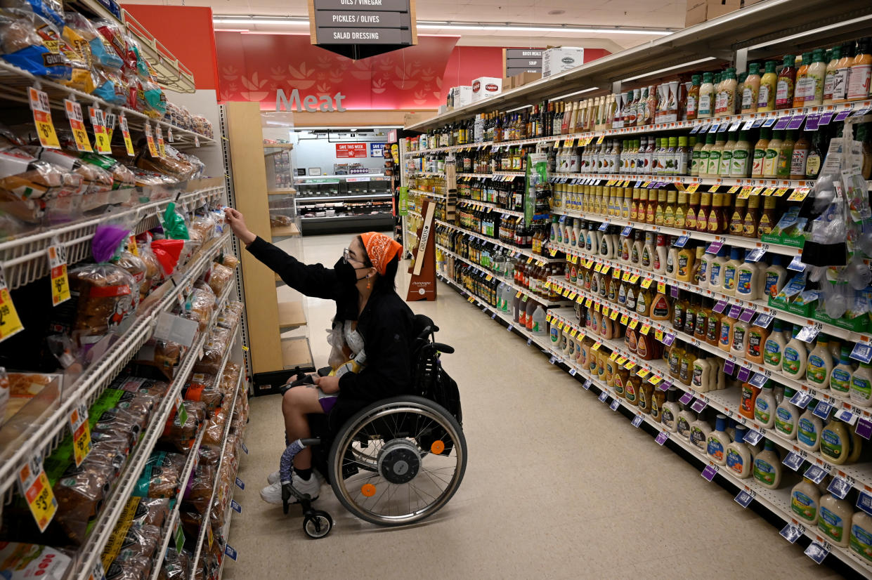Logan Kelble, who suffers from Ehlers-Danlos Syndrome hypermobility type 3 and Gastroparesis, shops at the supermarket as part of their routine, in Easton, Maryland, May 12, 2022. REUTERS/Magali Druscovich