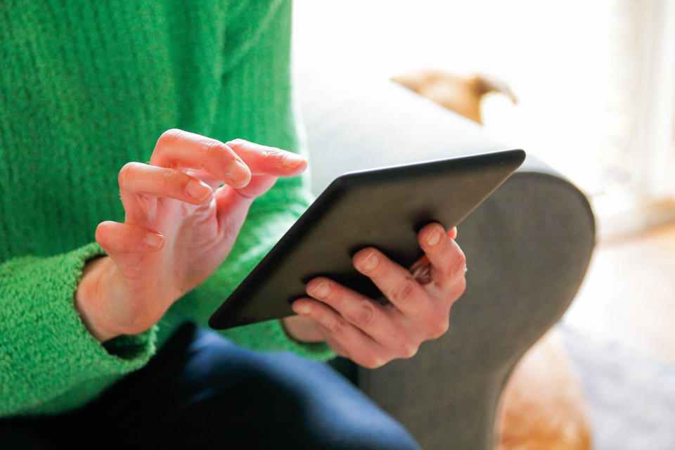 Using a digital tablet,  e-book reader