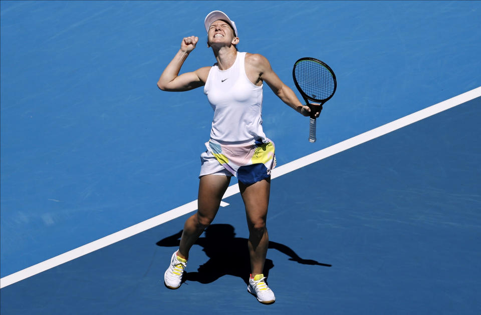 Romania's Simona Halep celebrates after defeating Estonia's Anett Kontaveit during their quarterfinal match at the Australian Open tennis championship in Melbourne, Australia, Wednesday, Jan. 29, 2020. (AP Photo/Dita Alangkara)