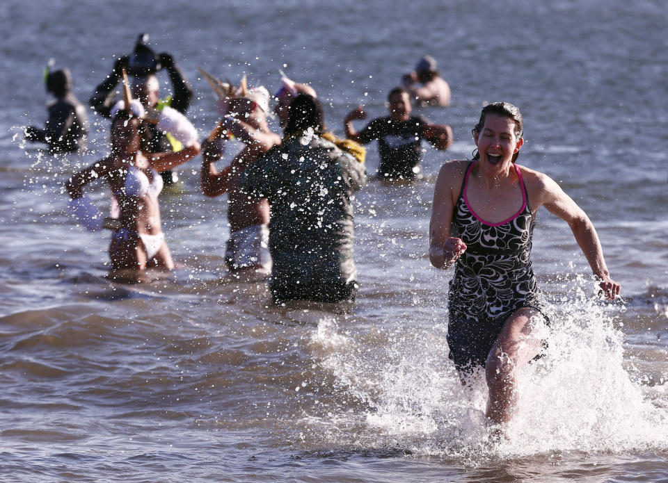 New Yorkers perform polar bear plunge at Coney Island