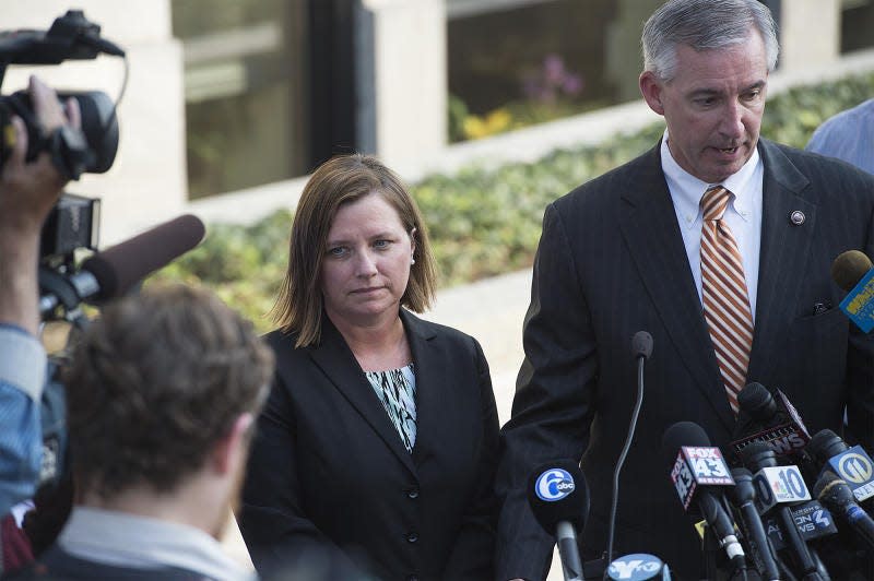 Montgomery County District Attorney Kevin Steele and former Bucks County First Assistant District Attorney Michelle Henry speak to media after Pennsylvania Attorney General Kathleen Kane leaves her preliminary hearing at the Montgomery County Courthouse on August 24, 2015.