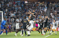 Minnesota United defender Michael Boxall (15) jumps high in the air to try to head a corner kick against Toronto FC during the second half of an MLS soccer match Saturday, June 3, 2023, in St. Paul, Minn. (Alex Kormann/Star Tribune via AP)