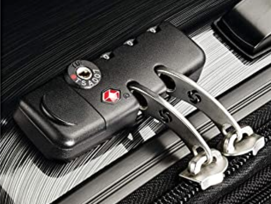 Close up of TSA-approved lock on Samsonite suitcase.