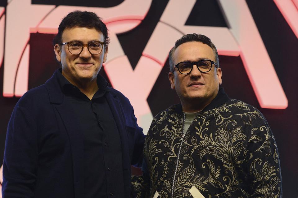 Movie directors and producers Joseph Russo (R) and his brother Anthony Russo pose for pictures during the press conference for their upcoming action thriller movie The Gray Man in Mumbai on July 21, 2022. (Photo by SUJIT JAISWAL / AFP) (Photo by SUJIT JAISWAL/AFP via Getty Images)