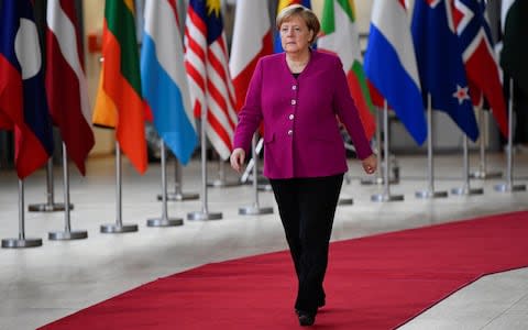 German Chancellor Angela Merkel arrives at the ASEM leaders summit in Brussels - Credit: TOBY MELVILLE/ REUTERS