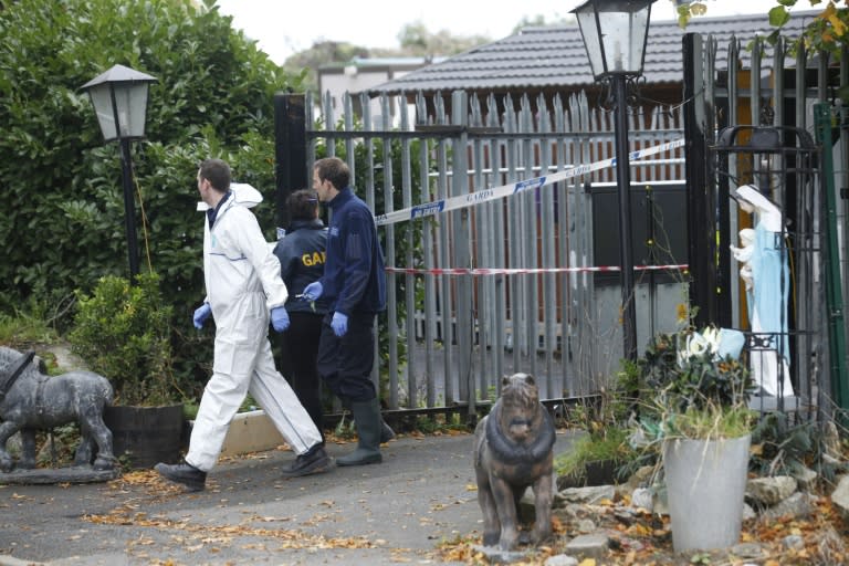 Police officers in the south Dublin suburb of Carrickmines on October 10, 2015, where a fire killed at least ten people