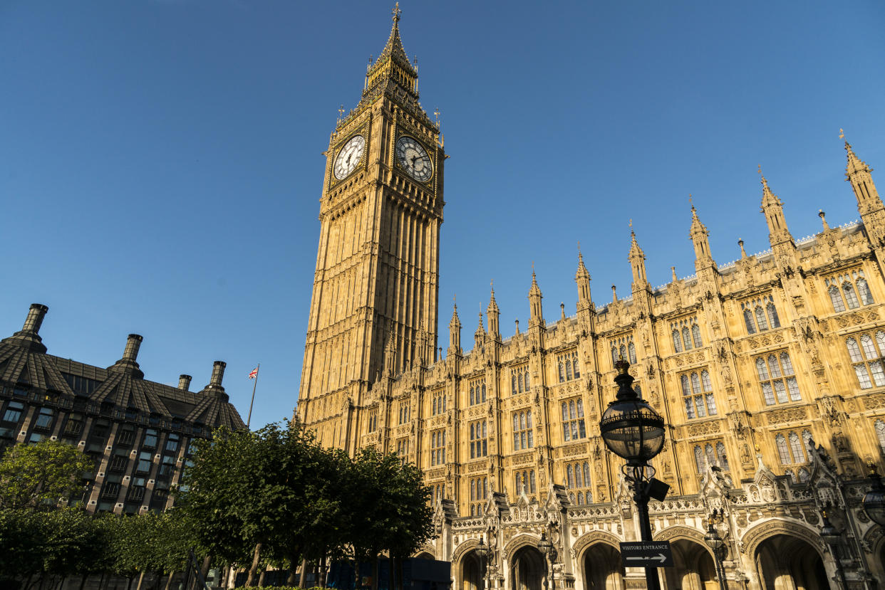 UK, England, London.  The British Houses of Parliament, housed in the Palace of Westminster.  Big Ben clock tower featured prominently.