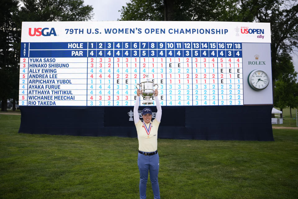 Yuka Saso, of Japan, holds the tournament trophy after winning the U.S. Women's Open golf tournament at Lancaster Country Club, Sunday, June 2, 2024, in Lancaster, Pa. (AP Photo/Matt Slocum)