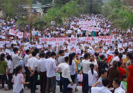 Vietnamese Catholics gather to protest against the Special Economic Zone's and cyber security's laws after a Sunday mass at a church in Ha Tinh province, Vietnam June 17, 2018. Photo taken June 17, 2018. REUTERS/Stringer