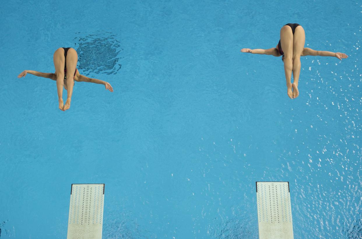 Paola Espinosa and Dolores Hernandez of Mexico compete in the Women's Synchronized 3M Springboard finals at the 2015 Pan American Games in Toronto, Canada, July 13, 2015.     AFP PHOTO/ JIM WATSON        (Photo credit should read JIM WATSON/AFP/Getty Images)