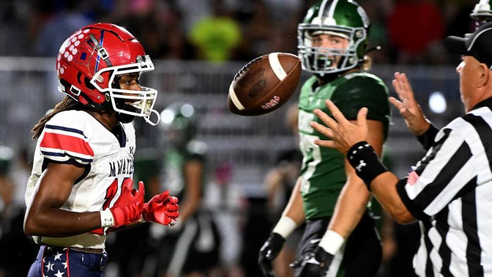 Manatee High’s Bon Bean tosses the ball to a referee after a play in Venice on Friday, Oct. 6, 2023.