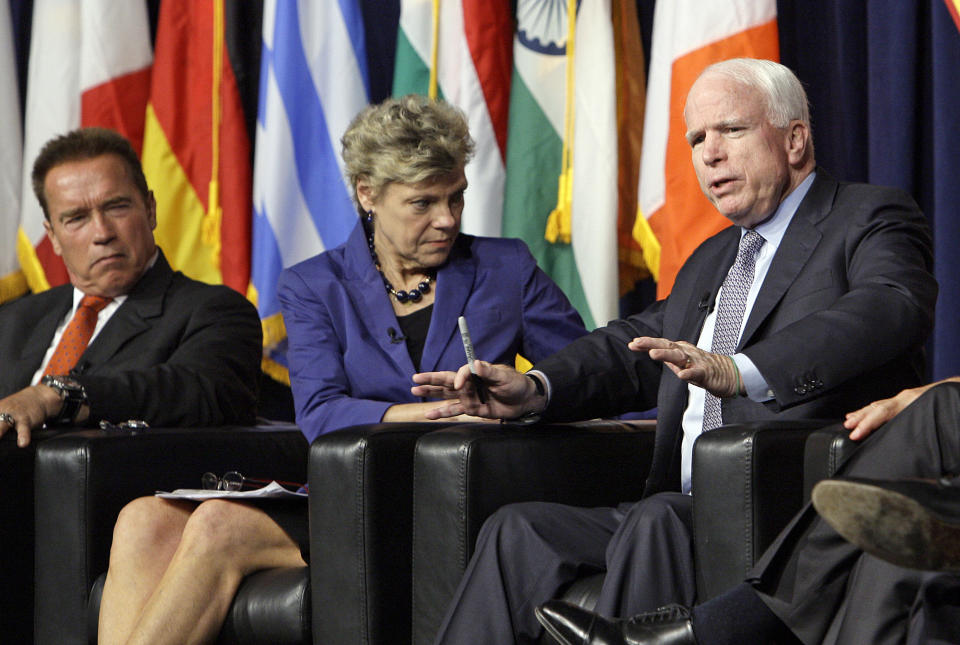 Former California Gov. Arnold Schwarzenegger, left, and moderator Cokie Roberts listen as Sen. John McCain, R-Ariz., speaks at the inaugural symposium sponsored by the Schwarzenegger Institute for State and Global Policy, at the University of Southern California in Los Angeles Monday, Sept. 24, 2012. (AP Photo/Reed Saxon)